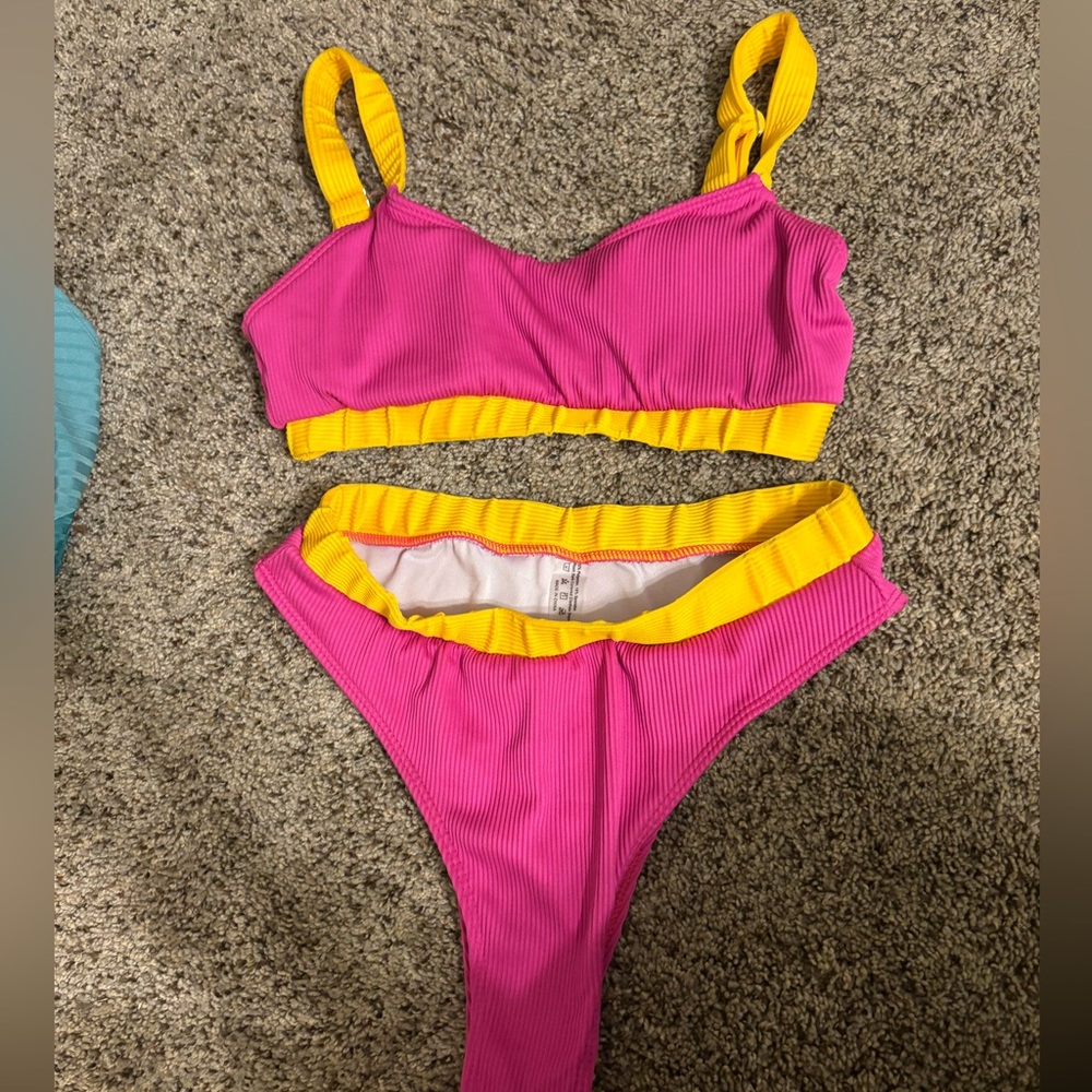 Women’s yellow and pink bikini. Bottoms are high wasted!